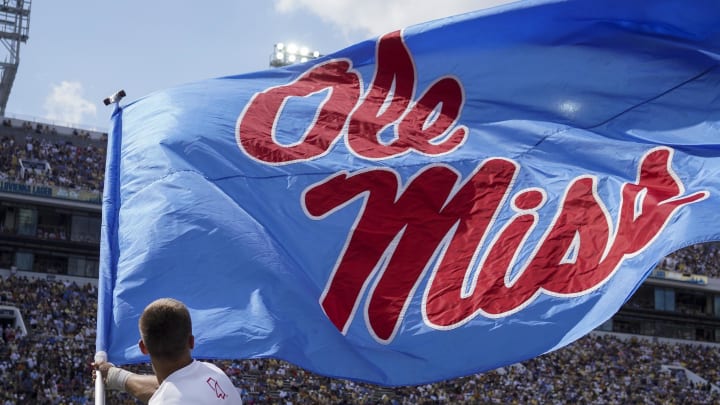 Sep 17, 2022; Atlanta, Georgia, USA; Mississippi Rebels cheerleader waves a flag after a touchdown against the Georgia Tech Yellow Jackets in the first quarter at Bobby Dodd Stadium. Mandatory Credit: Brett Davis-USA TODAY Sports
