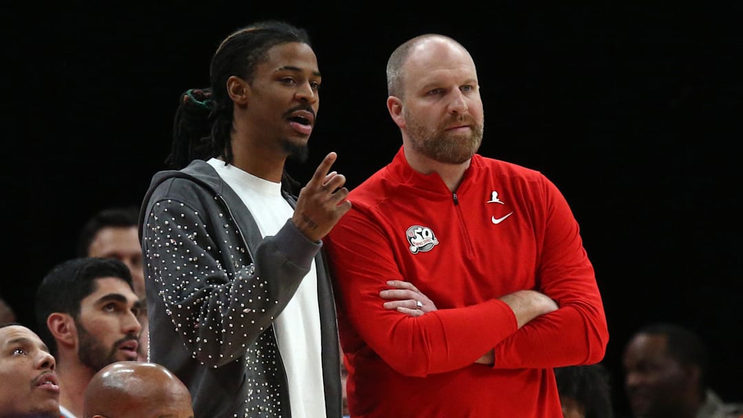 Mar 1, 2025; Memphis, Tennessee, USA; Memphis Grizzlies guard Ja Morant (left) talks with head coach Taylor Jenkins during the fourth quarter against the San Antonio Spurs at FedExForum. Mandatory Credit: Petre Thomas-Imagn Images