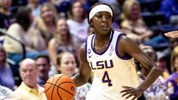 Nov 8, 2024; Baton Rouge, Louisiana, USA;  LSU Lady Tigers guard Flau'jae Johnson (4) brings the ball up court against the Northwestern State Lady Demons during the first half at Pete Maravich Assembly Center. Mandatory Credit: Stephen Lew-Imagn Images