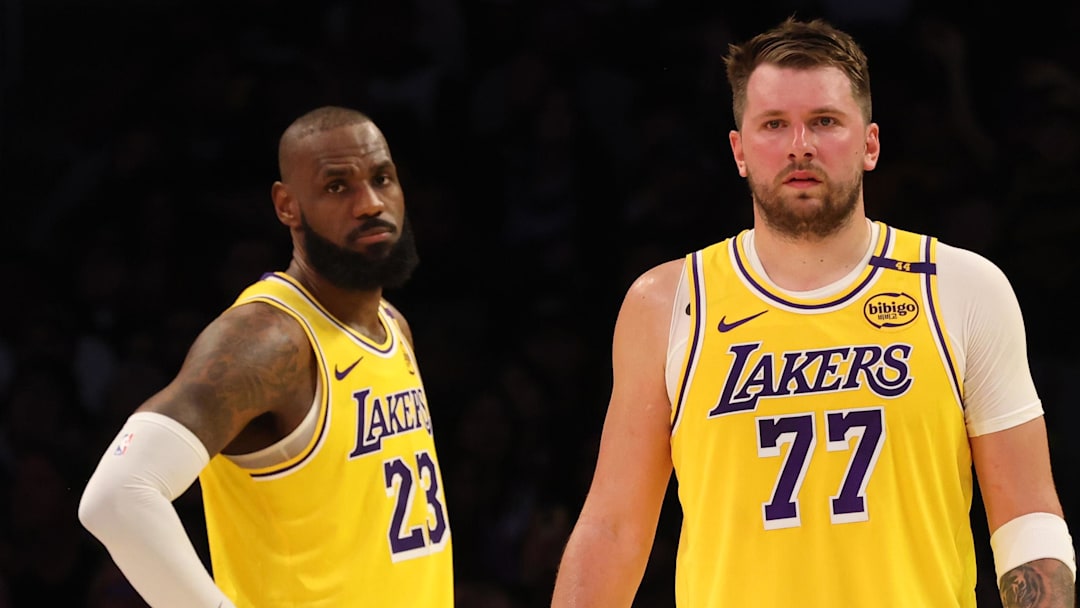 Feb 19, 2025; Los Angeles, California, USA; Los Angeles Lakers forward LeBron James (23) and guard Luka Doncic (77) during the second quarter against the Charlotte Hornets at Crypto.com Arena.
