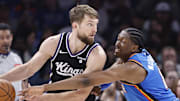 Apr 9, 2024; Oklahoma City, Oklahoma, USA; Oklahoma City Thunder forward Jalen Williams (8) defends Sacramento Kings forward Domantas Sabonis (10) during the second half at Paycom Center.