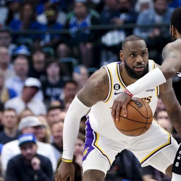 Feb 26, 2023; Dallas, Texas, USA; Los Angeles Lakers forward LeBron James (6) guards Dallas Mavericks guard Kyrie Irving (2) during the fourth quarter at American Airlines Center. Mandatory Credit: Kevin Jairaj-Imagn Images