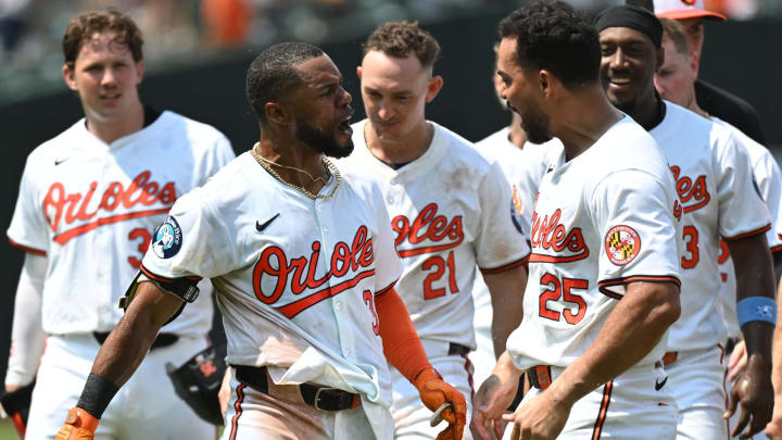 Jul 14, 2024; Baltimore, Maryland, USA;  Baltimore Orioles outfielder Cedric Mullins (31) and Anthony Santander (25) celebrate a walk-off win against the New York Yankees at Oriole Park at Camden Yards.