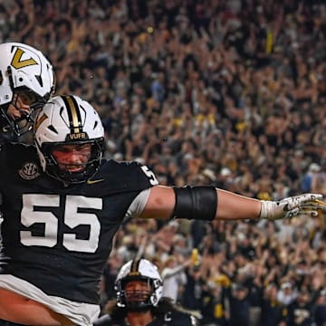 Vanderbilt tight end Cole Spence (16) celebrates his touchdown with offensive lineman Bryce Henderson (55) during overtime at FirstBank Stadium in Nashville, Tenn., Saturday, Nov. 8, 2025.