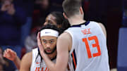 Feb 2, 2025; Champaign, Illinois, USA; Illinois Fighting Illini center Tomislav Ivisic (13) hugs teammate Illinois Kylan Boswell (4) after he was fouled during the second half against the Ohio State Buckeyes at State Farm Center. Mandatory Credit: Ron Johnson-Imagn Images