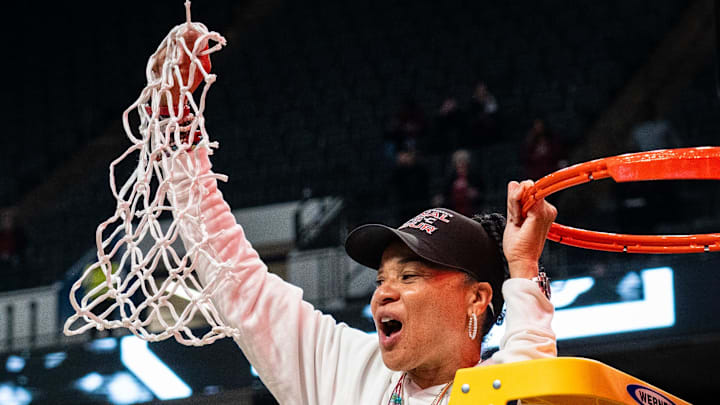 South Carolina coach Dawn Staley cuts the nets after the Gamecocks advance to the Final Four.
