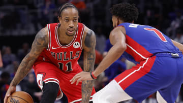 Apr 11, 2024; Detroit, Michigan, USA;  Chicago Bulls forward DeMar DeRozan (11) dribbles defended by Detroit Pistons forward Troy Brown Jr. (7) in the second half at Little Caesars Arena. Mandatory Credit: Rick Osentoski-USA TODAY Sports