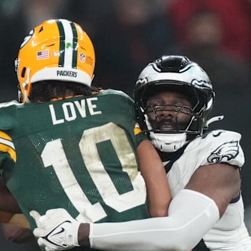 Green Bay Packers quarterback Jordan Love (10) is pressured by Philadelphia Eagles defensive end Josh Sweat.