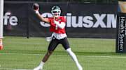 New York Jets quarterback Justin Fields participates in a drill during training camp at Atlantic Health Jets Training Center. 