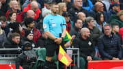 Constantine Hatzidakis was accused on elbowing Liverpool defender Andrew Robertson ar Anfield
