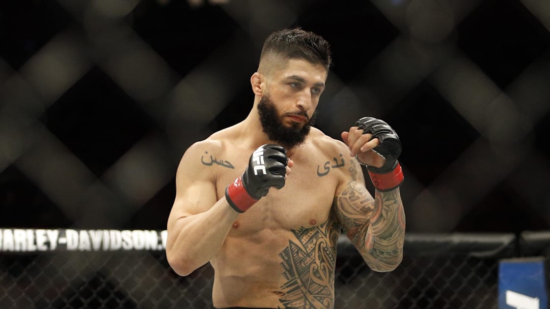 Dec 2, 2017; Detroit, MI, USA; Sabah Homasi (red gloves) fights Abdul Razak Alhassan (blues gloves) during UFC 218 at Little Caesars Arena. Mandatory Credit: Raj Mehta-Imagn Images