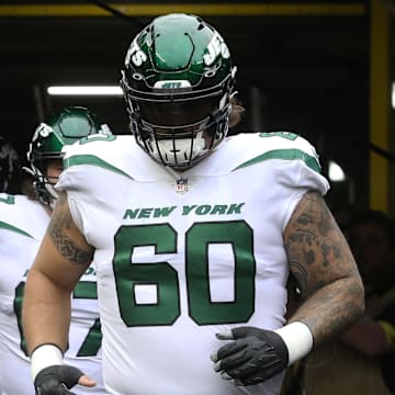 Oct 2, 2022; Pittsburgh, Pennsylvania, USA;  New York Jets quarterback Zach Wilson (2) and center Connor McGovern (60) take the field to warm up before the game against the Pittsburgh Steelers at Acrisure Stadium. 