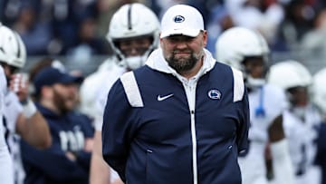 Apr 13, 2024; University Park, PA, USA; Penn State Nittany Lions offensive coordinator Andy Kotelnicki walks on the field during a warmup practice prior to the Blue White spring game at Beaver Stadium. Mandatory Credit: Matthew O'Haren-Imagn Images