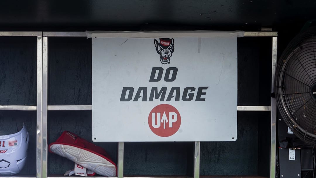 Jun 17, 2024; Omaha, NE, USA; NC State Wolfpack shortstop Brandon Butterworth (3) walks through the dugout before the game against the Florida Gators at Charles Schwab Field Omaha. Mandatory Credit: Dylan Widger-Imagn Images