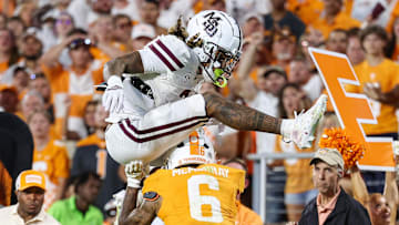 Mississippi State Bulldogs wide receiver Anthony Evans III (3) jumps over Tennessee Volunteers defensive back Jalen McMurray (6) during overtime at Davis Wade Stadium at Scott Field. 