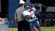 Tennessee Titans running back Jonathan Ward (33) carriers the ball as he runs through a drill during