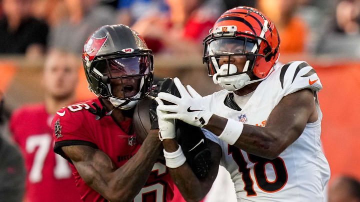 Tampa Bay Buccaneers cornerback Keenan Isaac (16) intercepts a pass intended for Cincinnati Bengals wide receiver Kwamie Lassiter II (18) in the second quarter of the NFL Preseason Week 1 game between the Cincinnati Bengals and the Tampa Bay Buccaneers at Paycor Stadium in downtown Cincinnati on Saturday, Aug. 10, 2024.