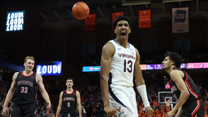Ryan Dunn reacts after dunking the ball during the Virginia men's basketball game against Northeastern at John Paul Jones Arena.