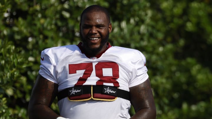 Jul 28, 2023; Ashburn, VA, USA; Washington Commanders offensive tackle Cornelius Lucas (78) and Commanders defensive end Andre Jones Jr. (48) walk to the fields on day three of Commanders training camp at OrthoVirginia Training Center. Mandatory Credit: Geoff Burke-USA TODAY Sports