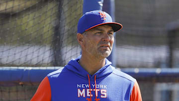 Mar 13, 2022; Port St. Lucie, FL, USA; New York Mets hitting coach Eric Chavez looks on as players take batting practice during spring training. Mandatory Credit: Sam Navarro-Imagn Images