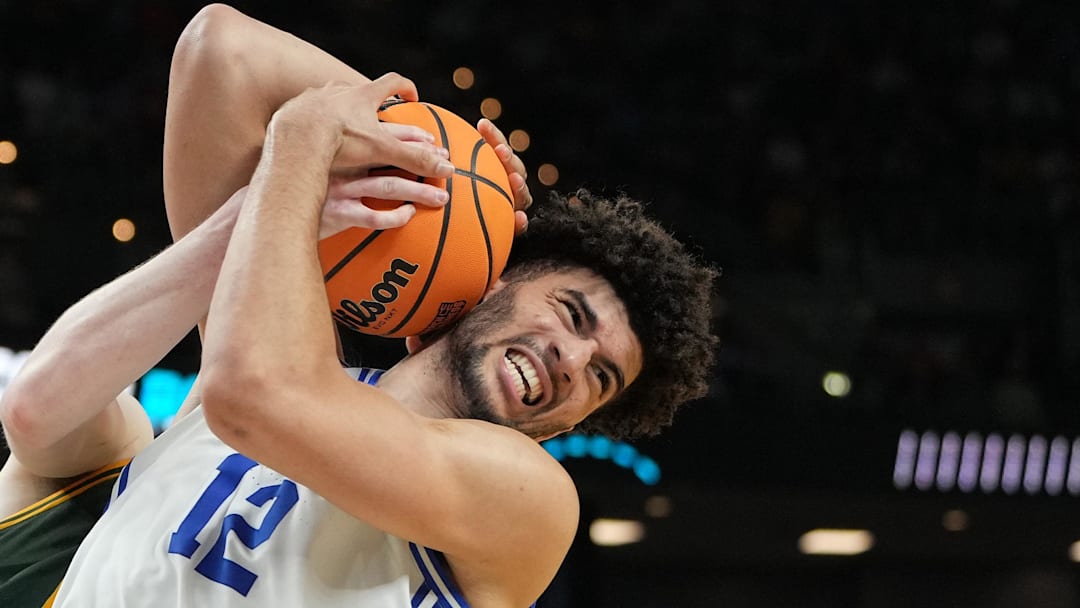 Mar 19, 2026; Greenville, SC, USA; Duke Blue Devils forward Cameron Boozer (12) reacts while getting a rebound against Siena Saints center Riley Mulvey (55) in the second half during a first round game of the men's 2026 NCAA Tournament at Bon Secours Wellness Arena. Mandatory Credit: Bob Donnan-Imagn Images Mar 19, 2026; Greenville, SC, USA; Duke Blue Devils forward Cameron Boozer (12) reacts while getting a rebound against Siena Saints center Riley Mulvey (55) in the second half during a first round game of the men's 2026 NCAA Tournament at Bon Secours Wellness Arena. Mandatory Credit: Bob Donnan-Imagn Images