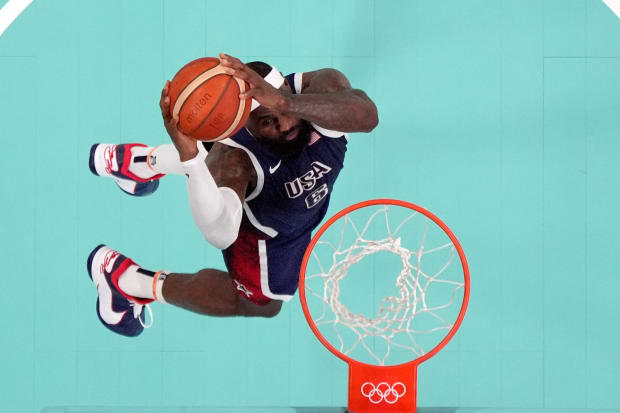 USA forward LeBron James dunks against Puerto Rico in the Olympics.