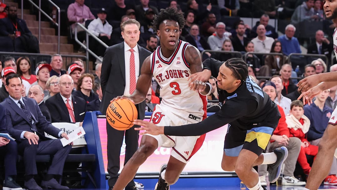 Jan 13, 2026; New York, New York, USA;  St. John's basketball guard Joson Sanon (3) drives past Marquette Golden Eagles guard Adrien Stevens (10) in the second half at Madison Square Garden