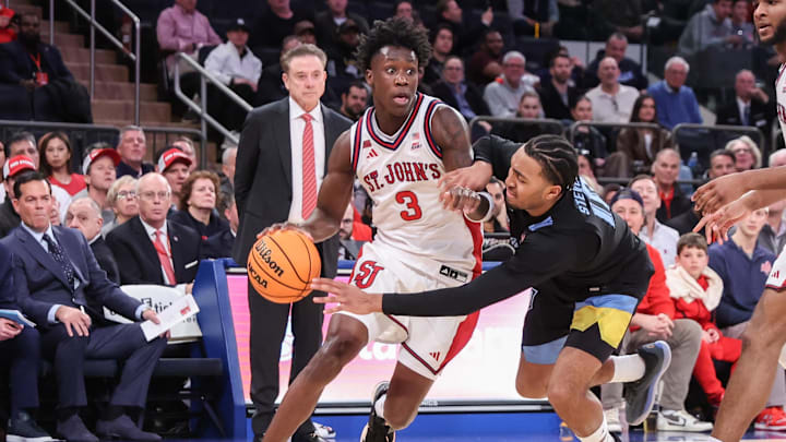 Jan 13, 2026; New York, New York, USA;  St. John's basketball guard Joson Sanon (3) drives past Marquette Golden Eagles guard Adrien Stevens (10) in the second half at Madison Square Garden
