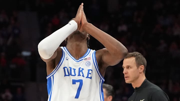 Mar 13, 2026; Charlotte, NC, USA; Duke Blue Devils guard Dame Sarr (7) reacts after making a shot in the second half.