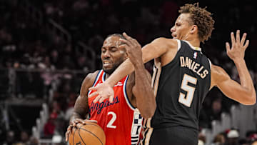 Dec 3, 2025; Atlanta, Georgia, USA; LA Clippers forward Kawhi Leonard (2) tries to get past Atlanta Hawks guard Dyson Daniels (5) during the second half at State Farm Arena. Mandatory Credit: Dale Zanine-Imagn Images