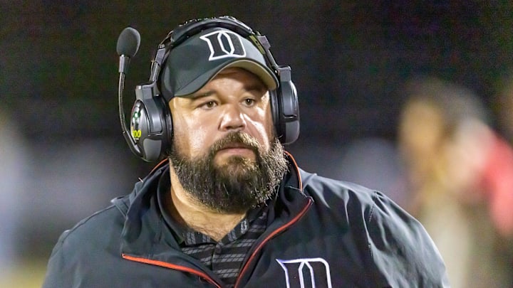 Dunnellon head coach Tommy Sutton keeps an eye on the action during a 3A FHSAA play off game at Dunnellon High School in Dunnellon, FL on Friday, November 15, 2024. [Alan Youngblood/Ocala Star-Banner]