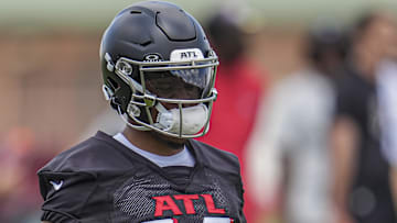 Former Atlanta Falcons wide receiver Rondale Moore (14) runs with the ball during Falcons OTA at the Falcons Training facility.