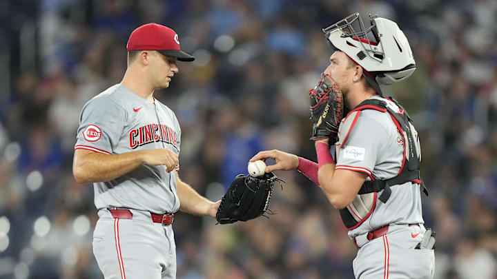 Cincinnati Reds catcher Tyler Stephenson (37) talks to starting pitcher Carson Spiers (68)