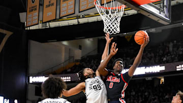 Feb 22, 2025; Nashville, Tennessee, USA; Mississippi Rebels forward Malik Dia (0) shoots over Vanderbilt Commodores forward Devin McGlockton (99) during the second half at Memorial Gymnasium. Mandatory Credit: Steve Roberts-Imagn Images