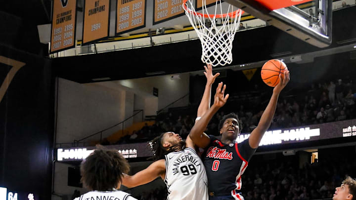 Feb 22, 2025; Nashville, Tennessee, USA; Mississippi Rebels forward Malik Dia (0) shoots over Vanderbilt Commodores forward Devin McGlockton (99) during the second half at Memorial Gymnasium. Mandatory Credit: Steve Roberts-Imagn Images