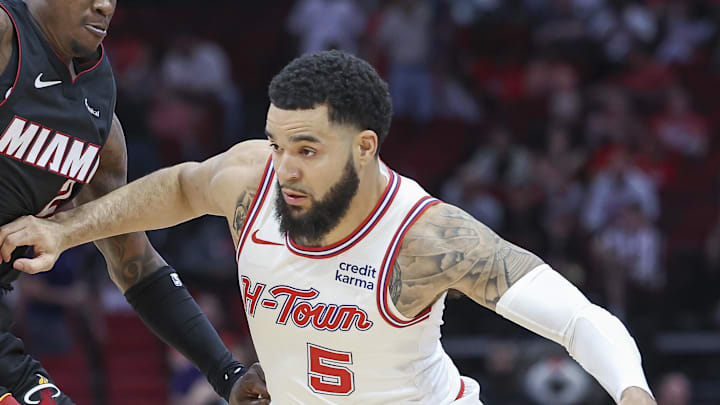 Apr 5, 2024; Houston, Texas, USA; Houston Rockets guard Fred VanVleet (5) drives with the ball as Miami Heat guard Terry Rozier (2) defends during the first quarter at Toyota Center. Mandatory Credit: Troy Taormina-Imagn Images