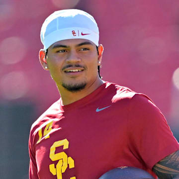 Oct 11, 2025; Los Angeles, California, USA;  USC Trojans quarterback Jayden Maiava (14) warms up prior to the game against the Michigan Wolverines at United Airlines Field at the Los Angeles Memorial Coliseum. Mandatory Credit: Jayne Kamin-Oncea-Imagn Images