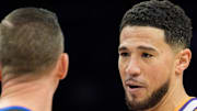 Nov 16, 2025; Phoenix, Arizona, USA; Phoenix Suns guard Devin Booker (1) reacts during a conversation with the referee during the second half of a game against the Atlanta Hawks at Mortgage Matchup Center. Mandatory Credit: Allan Henry-Imagn Images