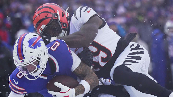 Buffalo Bills wide receiver Keon Coleman gets tackled by Cincinnati Bengals linebacker Barrett Carter after catching a pass during second half action at Highmark Stadium in Orchard Park on Dec. 7, 2025.