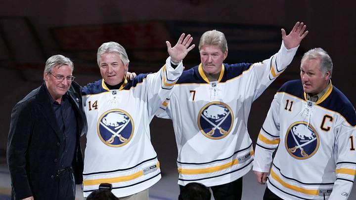 Feb 23, 2011; Buffalo, NY, USA;  New Buffalo Sabres owner Terry Pegula is introduced to the fans along with alumni players Rene Robert (14) , Rick Martin (7) and Gilbert Perreault (11) before a game against the Atlanta Thrashers at HSBC Arena.  Mandatory Credit: Timothy T. Ludwig-Imagn Images