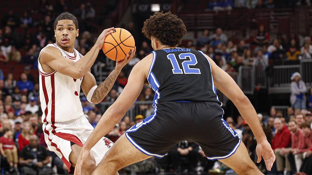 Nov 27, 2025; Chicago, Illinois, USA; Arkansas Razorbacks guard Darius Acuff Jr. (5) looks to pass the ball against Duke Blue Devils during the first half at United Center. Mandatory Credit: Kamil Krzaczynski-Imagn Images