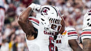 Dec 31, 2024; Orlando, FL, USA; South Carolina Gamecocks running back Dylan Stewart (6) celebrates his touchdown against the Illinois Fighting Illini in the fourth quarter at Camping World Stadium. Mandatory Credit: Jeremy Reper-Imagn Images