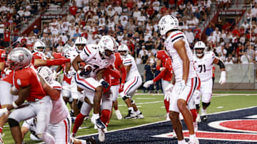 Aug 31, 2024; Tucson, Arizona, USA; Arizona Wildcats running back Quail Conley (7) runs a touchdown during third quarter at Arizona Stadium. Mandatory Credit: Aryanna Frank-Imagn Images