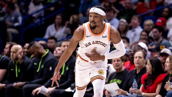 Apr 5, 2024; New Orleans, Louisiana, USA; San Antonio Spurs guard Devonte' Graham (4) reacts to