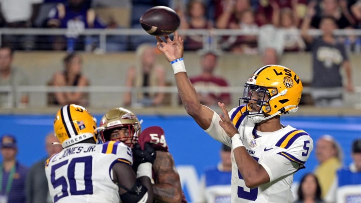 Sep 3, 2023; Orlando, Florida, USA; LSU Tigers quarterback Jayden Daniels (5) throws the ball during the fourth quarter against the Florida State Seminoles at Camping World Stadium. Mandatory Credit: Melina Myers-USA TODAY Sports