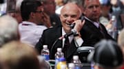 Jun 30, 2013; Newark, NJ, USA; New Jersey Devils general manager Lou Lamoriello speaks on the phone during the 2013 NHL Draft at the Prudential Center. Mandatory Credit: Ed Mulholland-Imagn Images