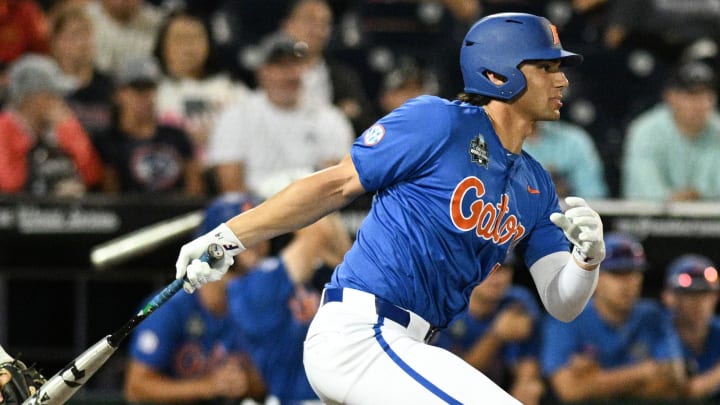 Florida Gators first baseman Jac Caglianone (14) singles in the 2024 College World Series. Sunday, the Plant High (Florida) grad was selected No. 6 overall in the first round of the 2024 MLB Draft.