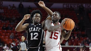 Feb 22, 2025; Norman, Oklahoma, USA; Oklahoma Sooners guard Duke Miles (15) drives to the basket beside Mississippi State Bulldogs guard Josh Hubbard (12) during the second half at Lloyd Noble Center. Mandatory Credit: Alonzo Adams-Imagn Images