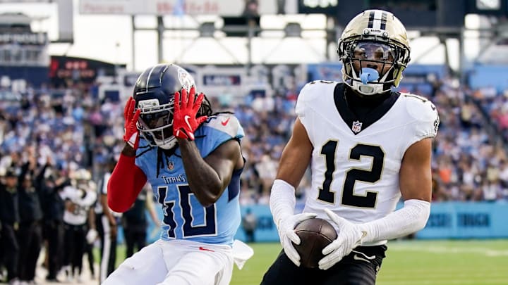 Tennessee Titans cornerback Kemon Hall (40) reacts as New Orleans Saints wide receiver Chris Olave (12) brings in a touchdown during the third quarter at Nissan Stadium in Nashville, Tenn., Sunday, Dec. 28, 2025.