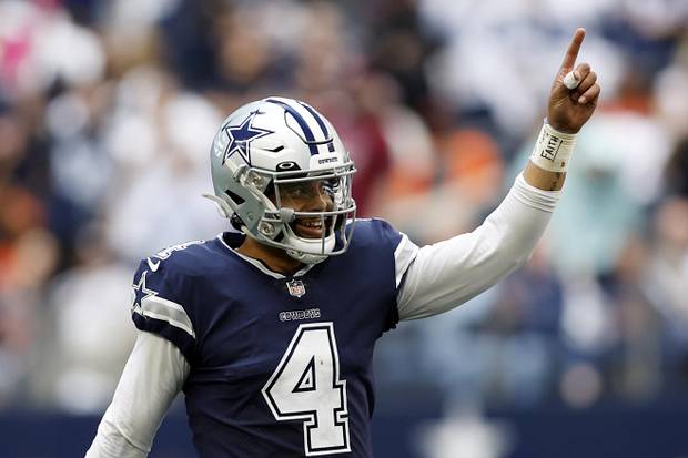 Dallas Cowboys quarterback Dak Prescott celebrates a touchdown in the fourth quarter against the Chicago Bears